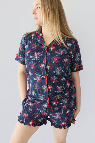 Women's short sleep set with navy blue fabric featuring red, white, and blue firework pattern, button-front top with red trim