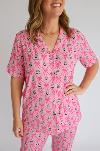 Pink pajama set with ribbon and figure print pattern, short sleeves and button front top.