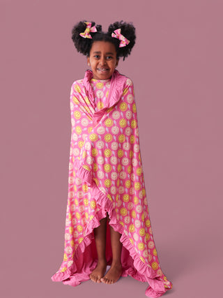 RADIANT SMILES DREAM RUFFLE BLANKET