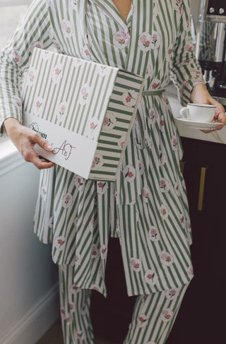 Women's robe in green and white stripes with pink floral pattern, long sleeves, and tie waist.