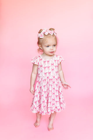 BOW CUTE DREAM RUFFLE DRESS