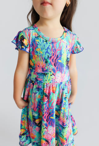 OCEAN GLOW CAP SLEEVE DREAM RUFFLE DRESS