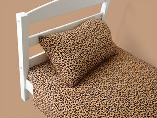 Twin sheet set with leopard print pattern in tan and black on white bed frame.