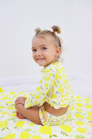 LEMON BLOSSOMS DREAM RASH GUARD RUFFLE TWO-PIECE SWIM SUIT