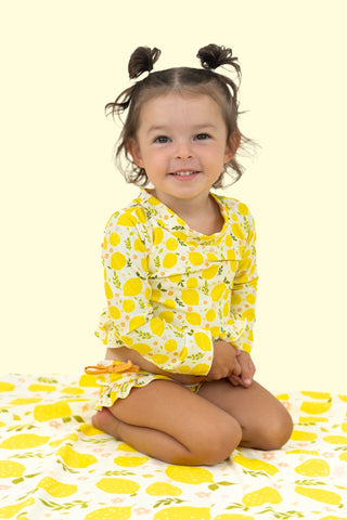 LEMON BLOSSOMS DREAM RASH GUARD RUFFLE TWO-PIECE SWIM SUIT