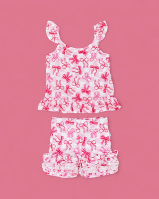 White and pink bow-print two-piece set with ruffled tank top and shorts with ruched hem.